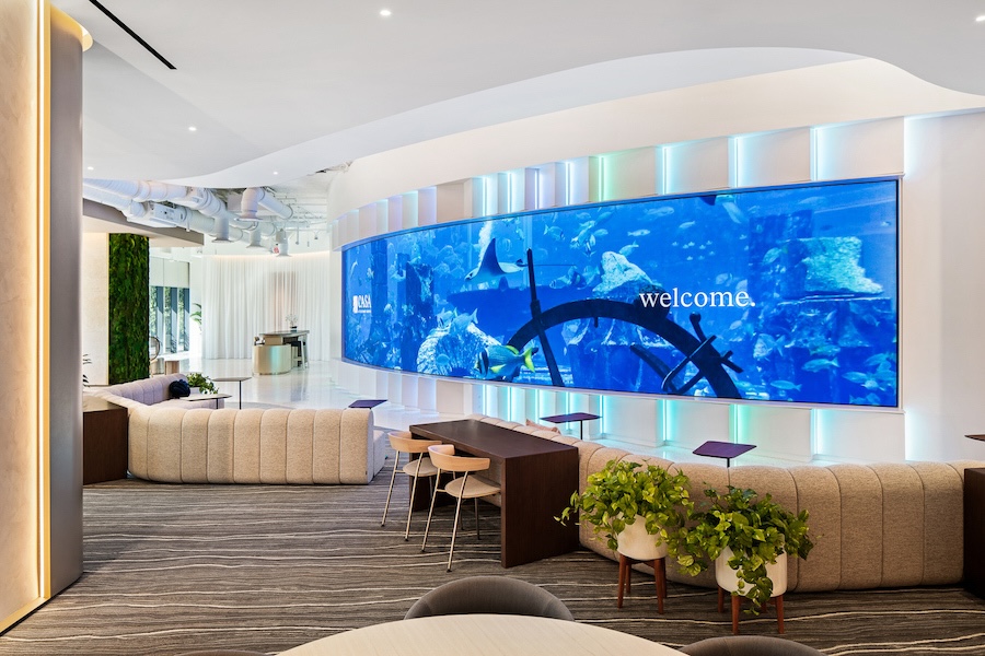 Curved video wall mounted on a curved wall in the Consilio Experience Center of Miami